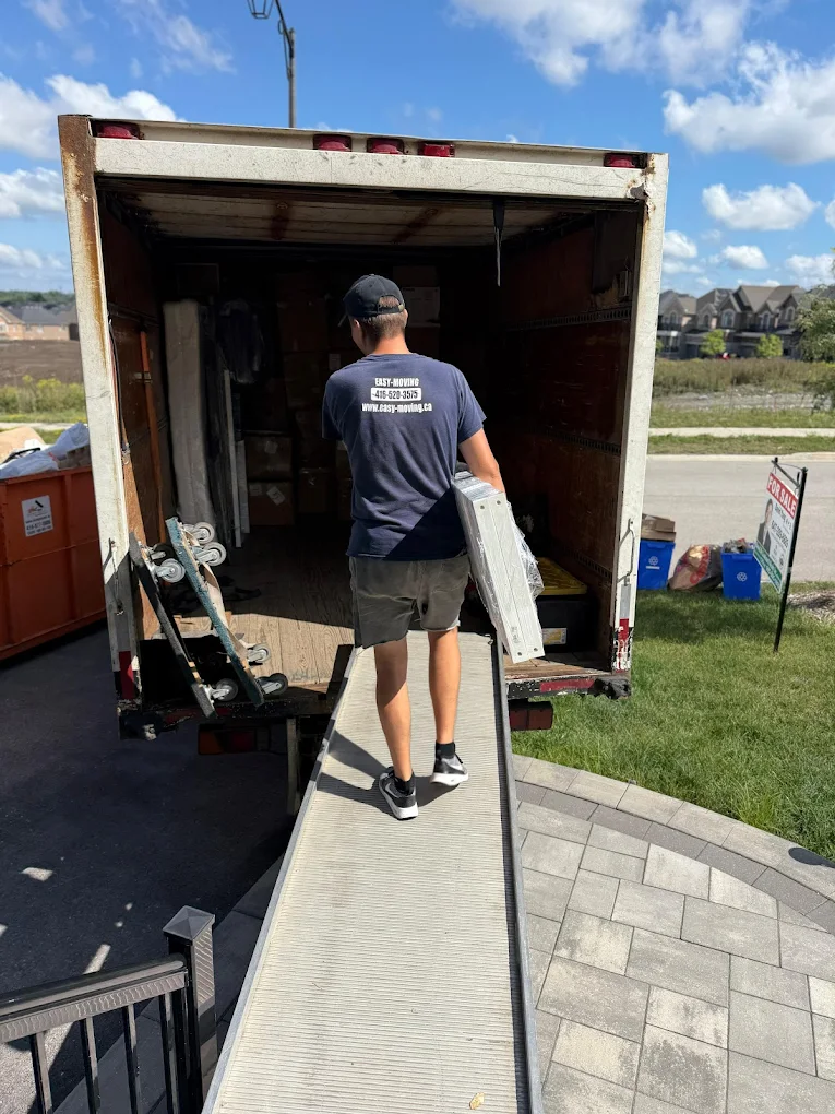 Mover loading items on a truck ramp