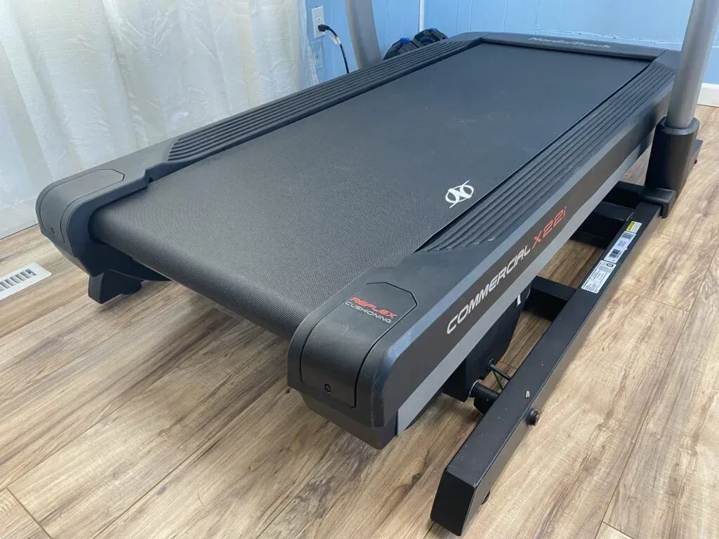 Treadmill secured in moving truck with blankets and straps