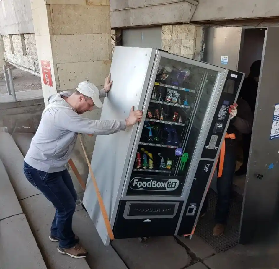 movers leveling vending machine on final location